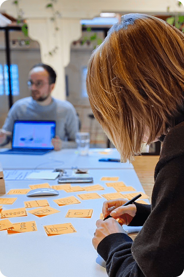 A Radial design sprint in progress, sketching the scoring concept on sticky notes.